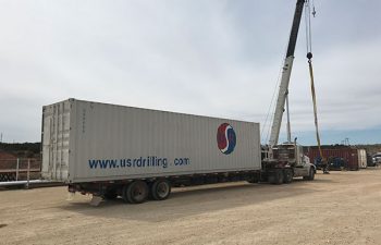 USR Drilling vehicle delivering drilling machinery.
